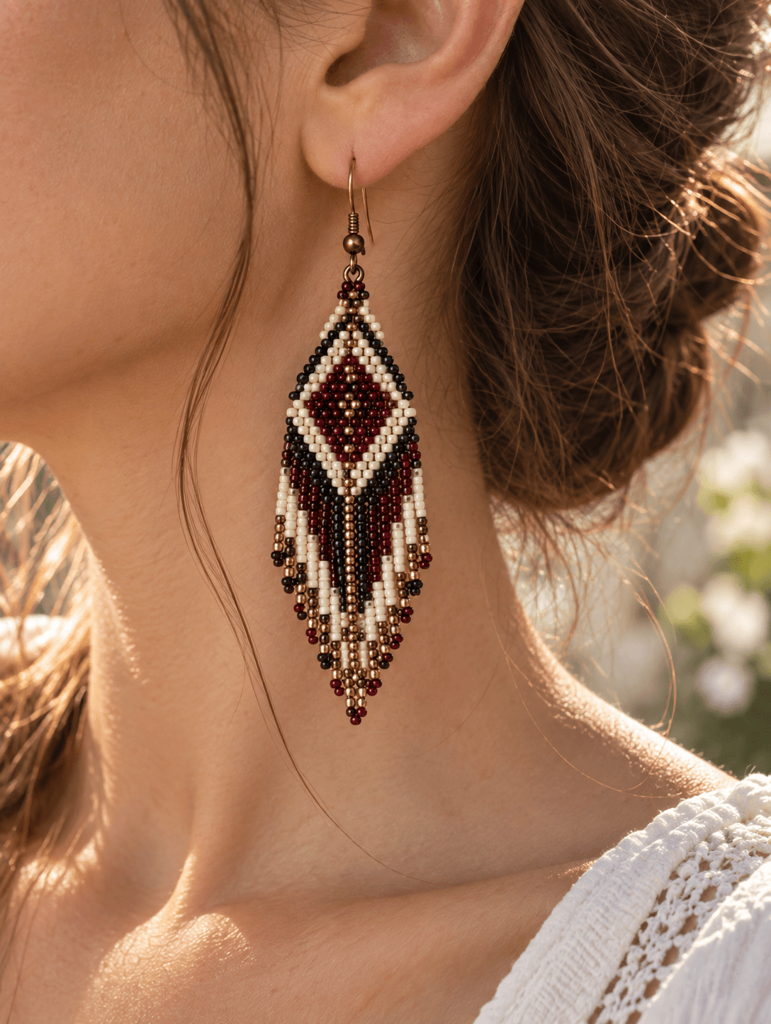 Long red, white, and black beaded earring