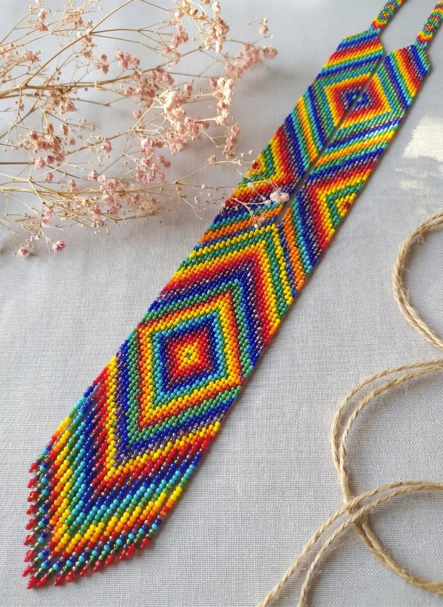 Rainbow gerdan with concentric diamonds and fringe